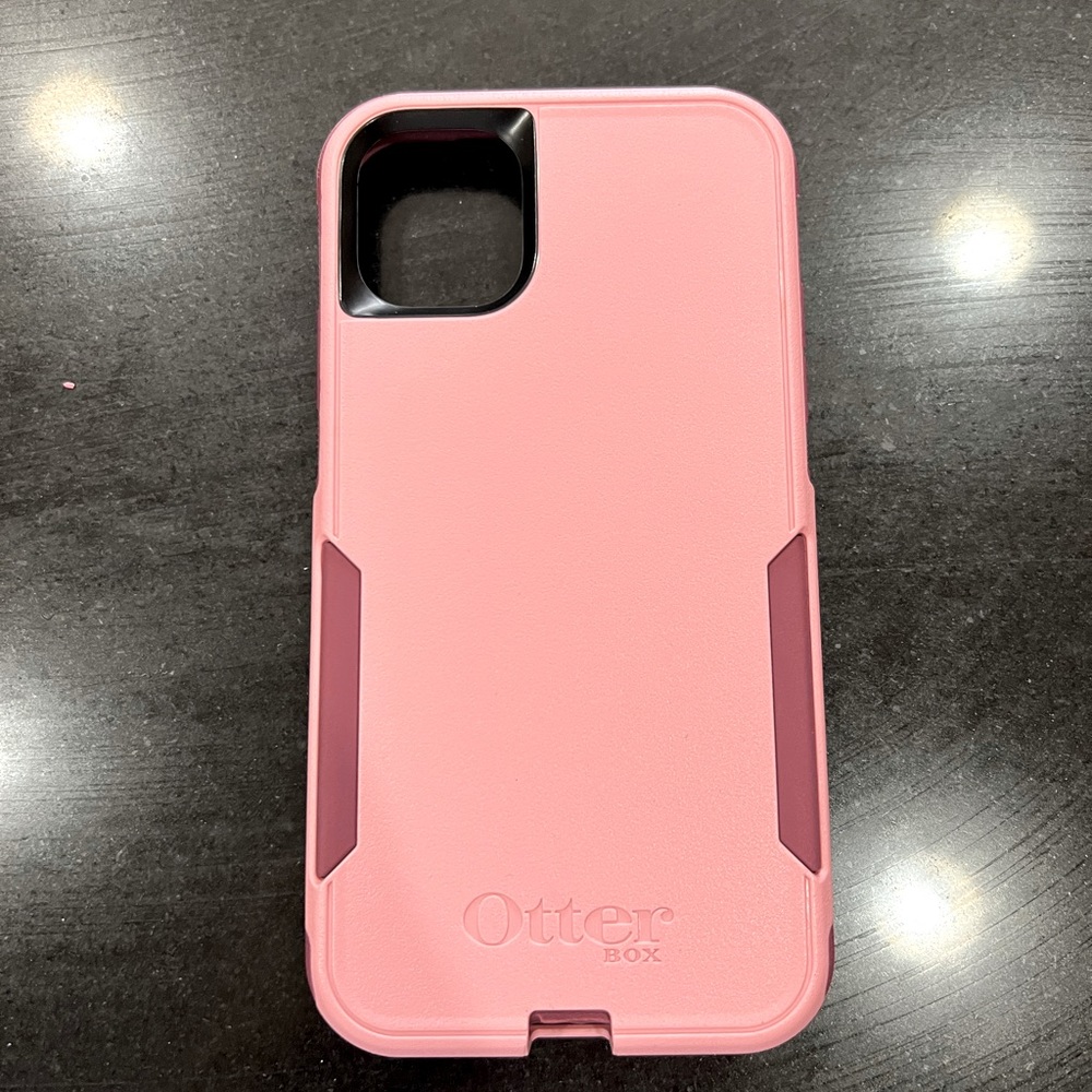 Pink/maroon otter box case. Can fit an iPhone XR. But it’s for iphone 11 .